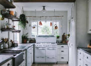 <p>The ruggedness and rustic charm of this DIY hanging pot rack make it the perfect addition to a farmhouse-style kitchen. Traipse through your own backyard to look for branches of birch or other durable woods. If you find a long, sturdy one, hang it above the stove to <a href="http://www.bobvila.com/slideshow/8-rules-to-break-for-an-organized-home-49703" rel="nofollow noopener" target="_blank" data-ylk="slk:stay organized;elm:context_link;itc:0;sec:content-canvas" class="link ">stay organized</a> and connected to nature at the same time. <i>Photo: <a href="http://www.adventures-in-cooking.com/2015/03/the-kitchen-remodel.html" rel="nofollow noopener" target="_blank" data-ylk="slk:adventures-in-cooking.com;elm:context_link;itc:0;sec:content-canvas" class="link ">adventures-in-cooking.com</a><br></i><b>RELATED: <a href="http://www.bobvila.com/slideshow/10-total-kitchen-makeovers-and-what-they-cost-49476" rel="nofollow noopener" target="_blank" data-ylk="slk:10 Total Kitchen Makeovers—and What They Cost;elm:context_link;itc:0;sec:content-canvas" class="link ">10 Total Kitchen Makeovers—and What They Cost</a></b></p>