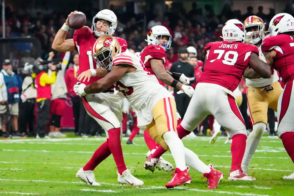 San Francisco 49ers defensive tackle Kevin Givens (90) sacks Arizona Cardinals quarterback Colt McCoy (12) during the second half at Estadio Azteca in Mexico City on Nov. 21, 2022.