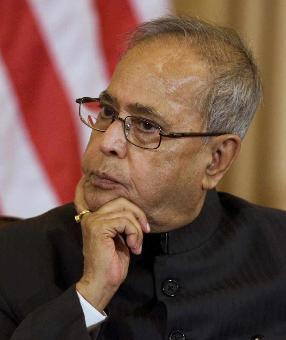 FILE- In this Oct. 10, 2008 file photo, India's then Foreign Minister Pranab Mukherjee, listens as to a speaker during the signing ceremony for the U.S.-India Agreement for Cooperation Concerning Peaceful Uses of Nuclear Energy, at the State Department, in Washington. Former President Pranab Mukherjee, who was a key troubleshooter in managing fractious coalitions as a member of India's long-governing Congress party died Monday evening. He was 84. Mukherjee had emergency surgery for a blood clot in his brain on August 10 at New Delhi's Army Hospital Research and Referral. (AP Photo/Manuel Balce Ceneta, File)