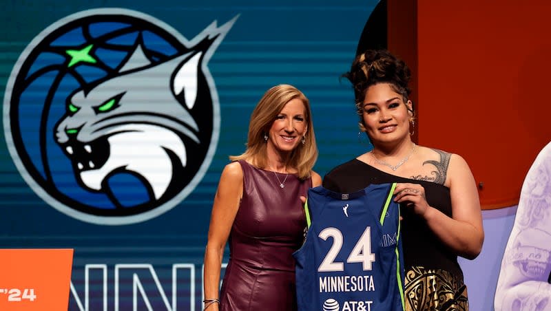 Utah's Alissa Pili, right, poses for a photo with WNBA commissioner Cathy Engelbert after being selected eighth overall by the Minnesota Lynx during the first round of the WNBA basketball draft on Monday, April 15, 2024, in New York.