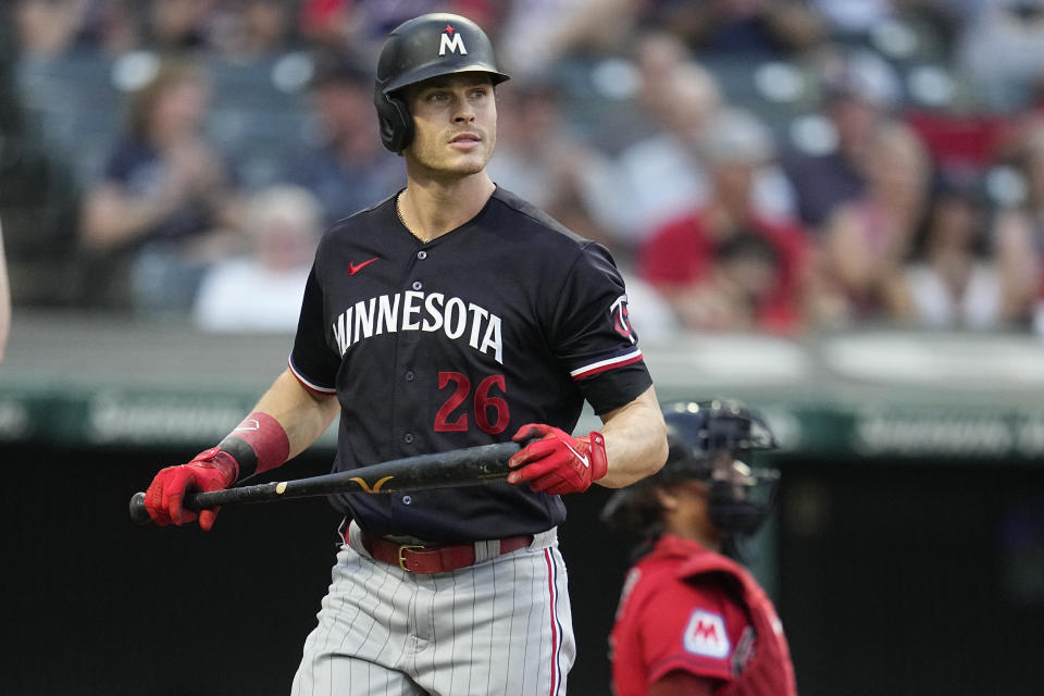 Minnesota Twins' Max Kepler walks back to the dugout after striking out in the fifth inning of a baseball game against the Cleveland Guardians, Tuesday, Sept. 5, 2023, in Cleveland. (AP Photo/Sue Ogrocki)