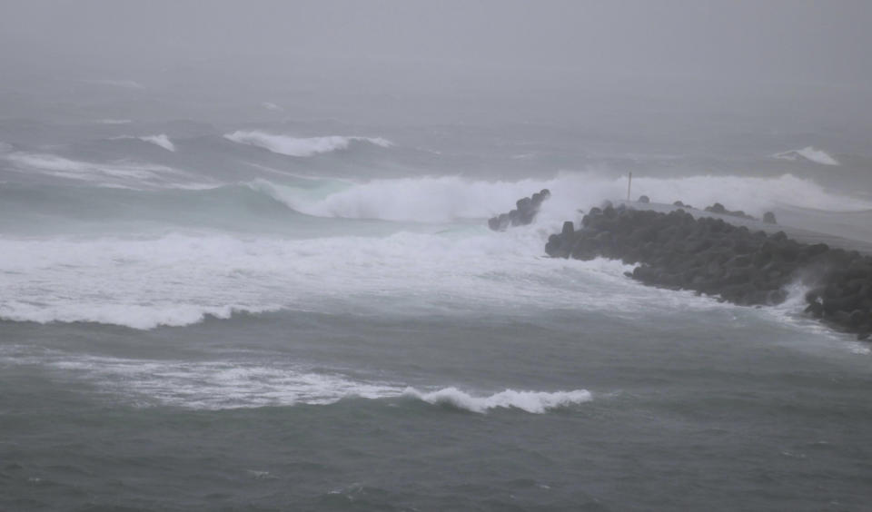 High waves caused by approaching Tropical Storm Khanun hit a port on Amami Oshima Island, Kagoshima prefecture, southern Japan Monday, Aug. 7, 2023. (Kyodo News via AP)