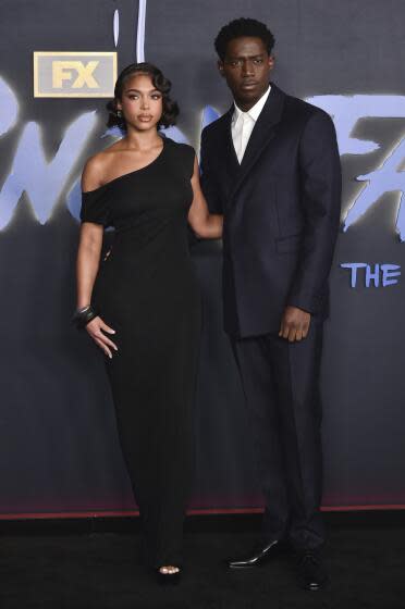 Lori Harvey, left, and Damson Idris arrive at the premiere of the sixth and final season of "Snowfall"