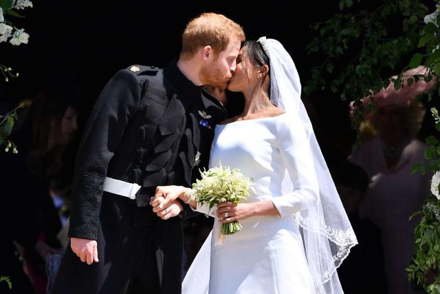 BEN STANSALL/AFP via Getty Images Prince Harry and Meghan Markle on their wedding day