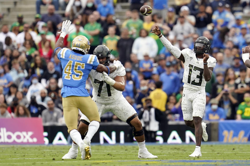 Oregon quarterback Anthony Brown (13) throws during the first half of an NCAA college football game against UCLA, Saturday, Oct. 23, 2021, in Pasadena, Calif. (AP Photo/Marcio Jose Sanchez)