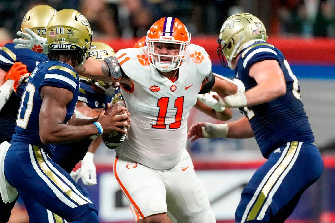 Clemson Tigers defensive tackle Bryan Bresee (11) goes after Georgia Tech Yellow Jackets quarterback Jeff Sims (10) during the 2022 Chick-fil-A Kickoff Game, Monday, Sept. 5, 2022, in Atlanta.