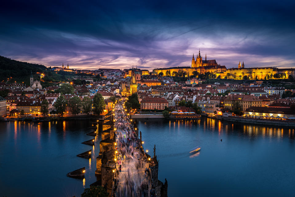 Twilight overview of Charles Bridge, city and river in Prague, Czech Republic. (Photo: Gettyimages)