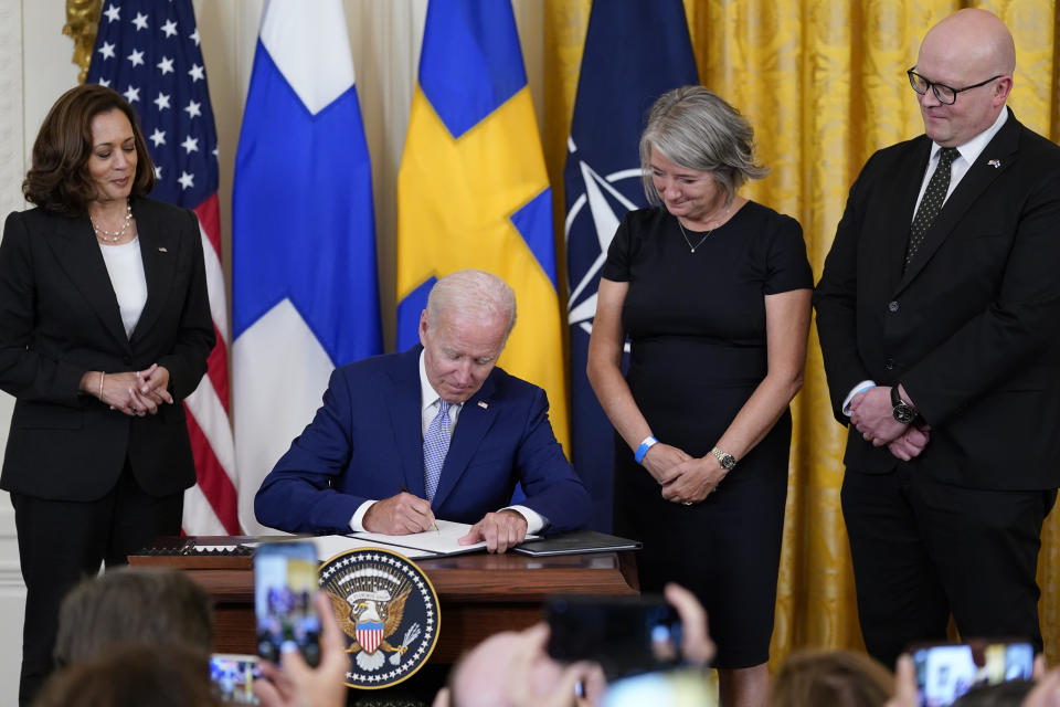 President Joe Biden signs the Instruments of Ratification for the Accession Protocols to the North Atlantic Treaty for the Kingdom of Sweden in the East Room of the White House in Washington, Tuesday, Aug. 9, 2022. From left, Vice President Kamala Harris, Biden, Karin Olofsdotter, Sweden's ambassador to the U.S., and Mikko Hautala, Finland's ambassador to the U.S. (AP Photo/Susan Walsh)