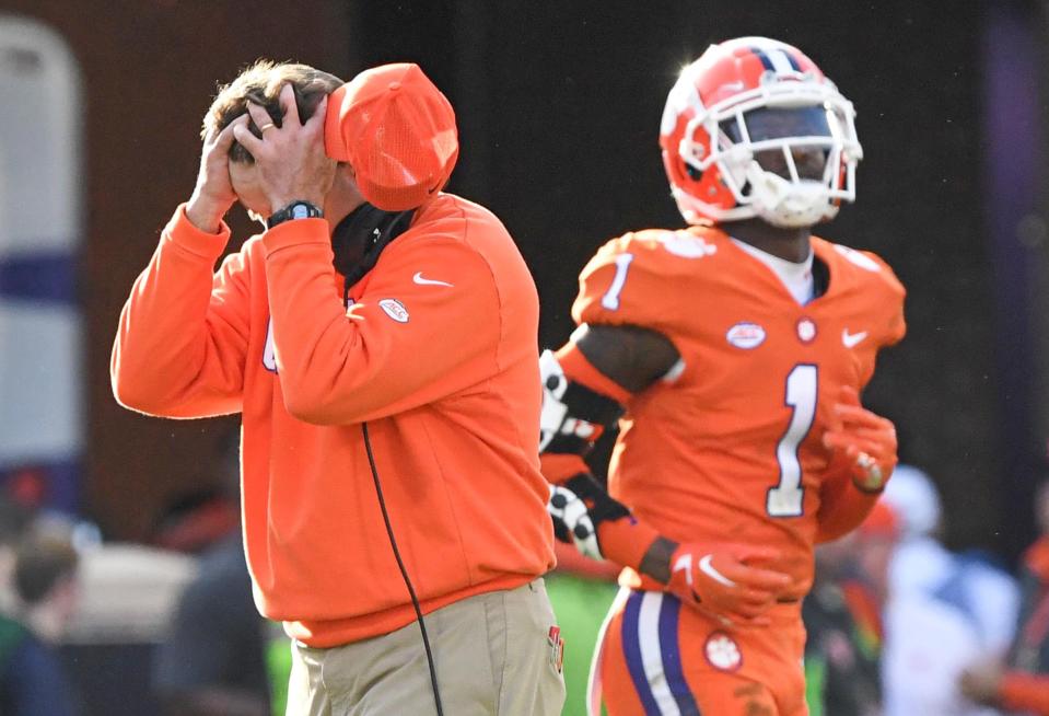 Clemson coach Dabo Swinney holds his head after wide receiver Antonio Williams fumbled a ball to South Carolina during the fourth quarter at Memorial Stadium in Clemson, South Carolina Saturday, Nov. 26, 2022.