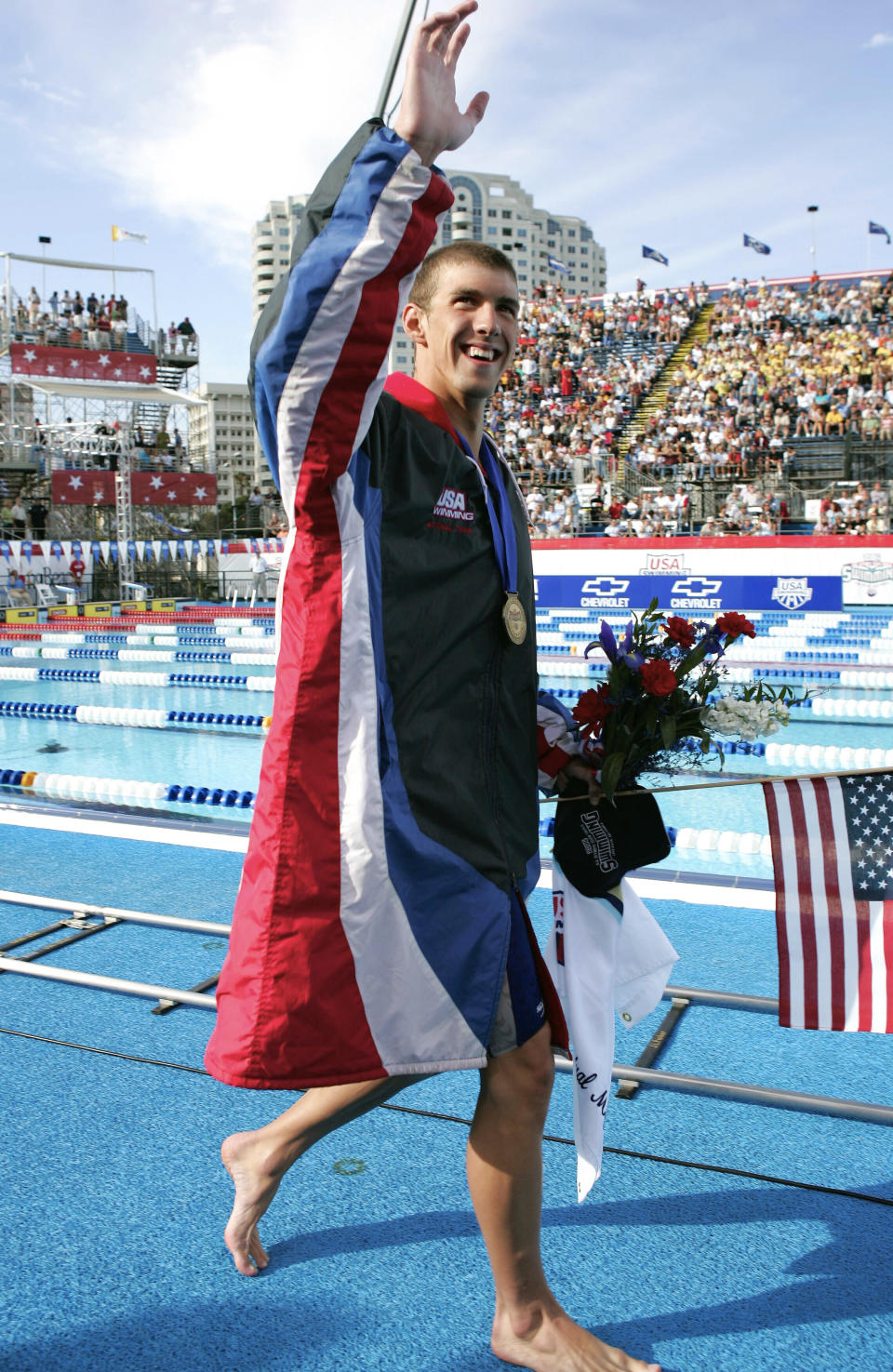 FILE - In this July 7, 2004, file photo, Michael Phelps celebrates after breaking his own world record in the 400-meter individual medley with a time of four minutes, 8.41 seconds at the U.S. Olympic swimming trials in Long Beach, Calif. For the first time since 1996, the U.S. Olympic swimming trials are being held without Phelps, the sport's biggest star, the guy who won a staggering 23 gold medals and 28 medals overall at the Olympics. (AP Photo/Mark J. Terrill, File)