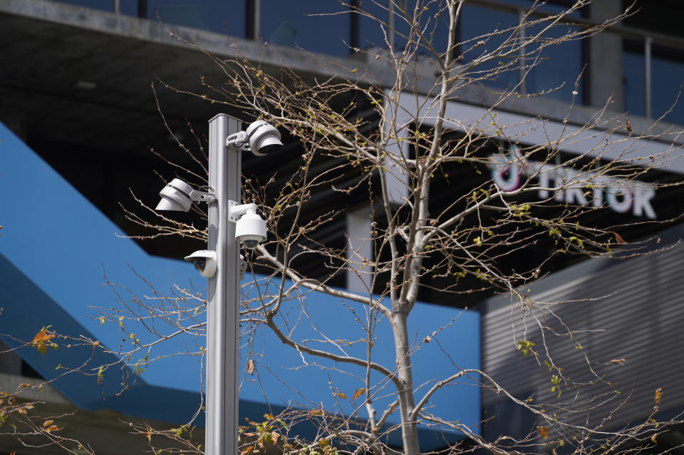 File - Security cameras are seen at the TikTok Inc. building in Culver City, Calif., Friday, March 17, 2023. The battle between the U.S. and China over TikTok comes to a head on Thursday when the social media platform’s CEO testifies before Congressional lawmakers. (AP Photo/Damian Dovarganes, File)