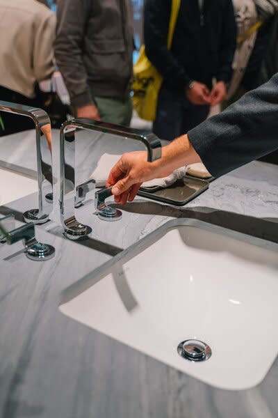 These handles from the Guise collection, which, along with the tap, are single-cast pieces, featured one of two guilloche pattern inlays the company offers—mesmerizing, but subtle against the gray counter. The tap and flush-mount handles were buttery smooth to turn, and just as easy to look at.