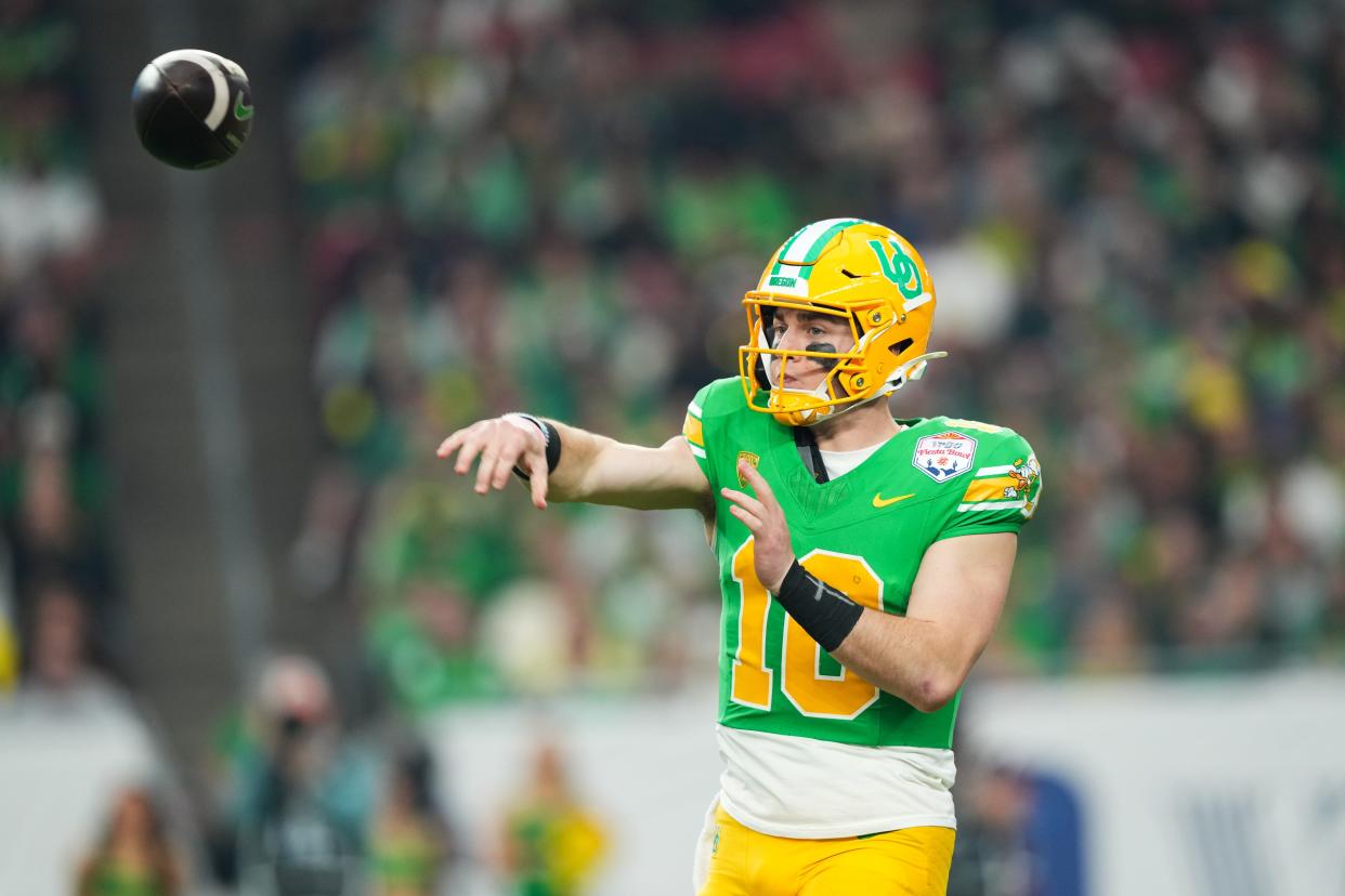 Jan 1, 2024; Glendale, AZ, USA; Oregon Ducks quarterback Bo Nix (10) throws against the Liberty Flames during the second half in the 2024 Fiesta Bowl at State Farm Stadium. Mandatory Credit: Joe Camporeale-USA TODAY Sports