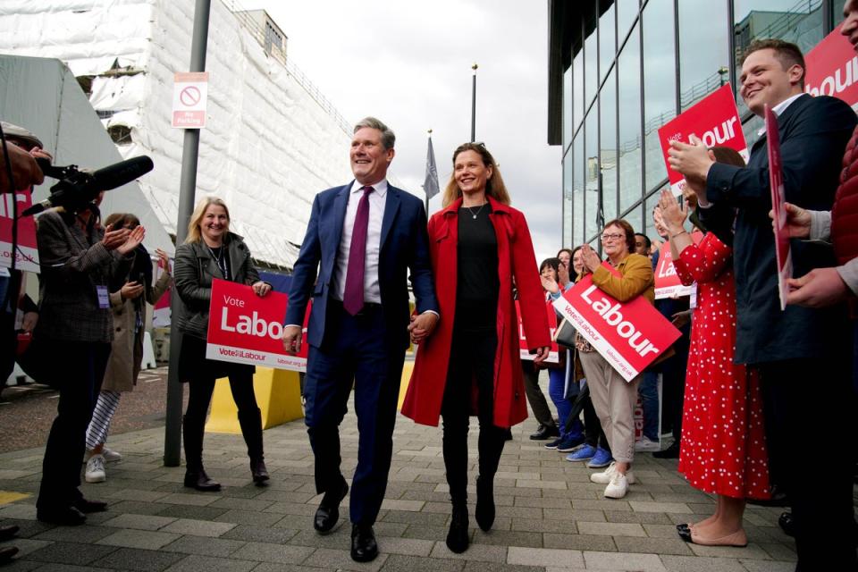 Sir Keir Starmer and his wife Victoria are greeted by Labour supporters as they arrive at the Pullman Hotel Liverpool ahead of the Labour Party conference (Peter Byrne/PA) (PA Wire)