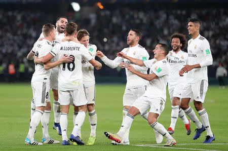 Soccer Football - Club World Cup - Final - Real Madrid v Al Ain - Zayed Sports City Stadium, Abu Dhabi, United Arab Emirates - December 22, 2018 Real Madrid's Marcos Llorente celebrates scoring their second goal with team mates REUTERS/Suhaib Salem