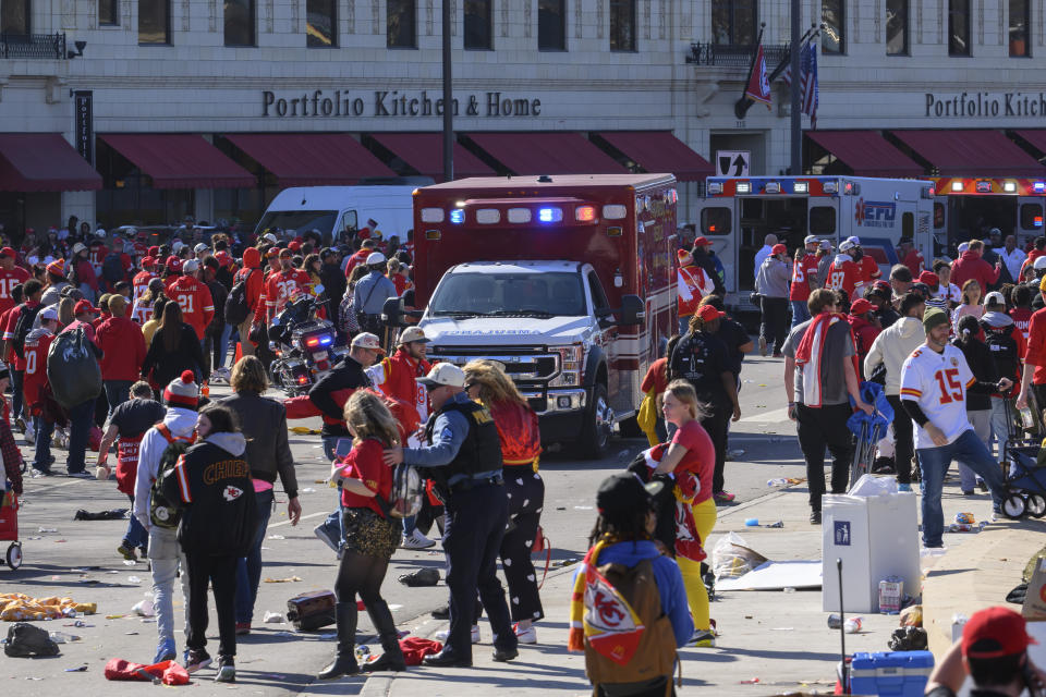 FILE - Police clear the area following a shooting at the Kansas City Chiefs NFL football Super Bowl celebration in Kansas City, Mo., Wednesday, Feb. 14, 2024. A third man is now facing murder charges for the Feb. 14 shootings during the Kansas City Chiefs' Super Bowl rally. One woman died and about two dozen other people were hurt in the burst of gunfire. (AP Photo/Reed Hoffmann, File)