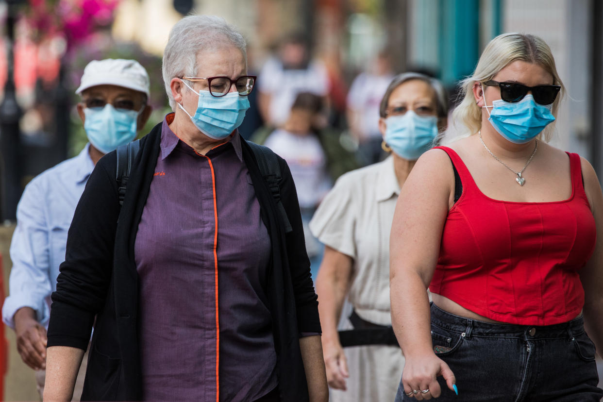 Shoppers wear face coverings to help prevent the spread of the coronavirus on 20 September 2020 in Staines-Upon-Thames, United Kingdom. The Borough of Spelthorne, of which Staines-upon-Thames forms part along with Ashford, Sunbury-upon-Thames, Stanwell, Shepperton and Laleham, has been declared an area of concern for COVID-19 by the government following a marked rise in coronavirus infections which is inconsistent with other areas of Surrey. (photo by Mark Kerrison/In Pictures via Getty Images)