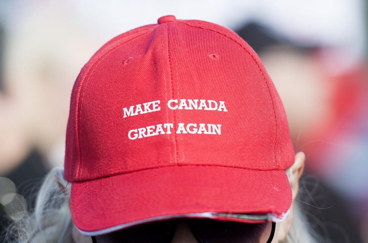 <span class="caption">A woman wears a Make Canada Great Again cap during a demonstration opposing government policy on immigration near the Canada-U.S. border in 2019.</span> <span class="attribution"><span class="source">THE CANADIAN PRESS/Graham Hughes </span></span>