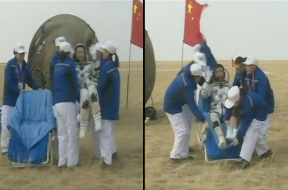 Taikonauts Jing Haipeng and Chen Dong are seen after landing on board China's Shenzhou 11 spacecraft on Nov. 18. <cite>CCTV</cite>