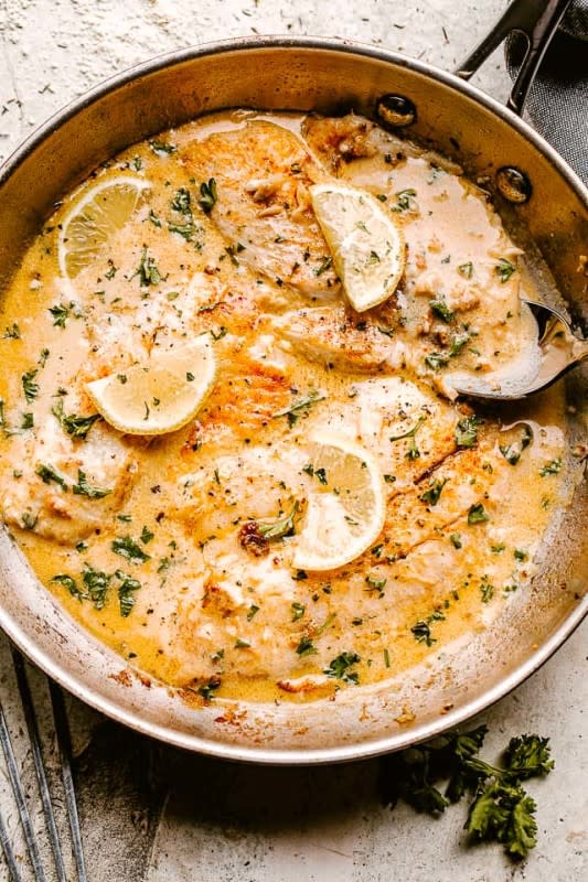 <p>Diethood</p><p>This skillet tilapia with creamy lemon sauce tastes like summertime. The fresh garlic, herbs, and lemon juice will immediately transport you to a balcony Bistro on the Island of Capri without ever leaving your house.</p><p><strong>Get the recipe: <a href="https://diethood.com/skillet-tilapia-with-creamy-lemon-sauce/" rel="nofollow noopener" target="_blank" data-ylk="slk:Skillet Tilapia with Creamy Lemon Sauce;elm:context_link;itc:0;sec:content-canvas" class="link ">Skillet Tilapia with Creamy Lemon Sauce</a></strong></p>