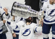 Tampa Bay Lightning's Nikita Kucherov (86) hoists the Stanley Cup after defeating the Dallas Stars in the NHL Stanley Cup hockey finals, in Edmonton, Alberta, on Monday, Sept. 28, 2020. (Jason Franson/The Canadian Press via AP)