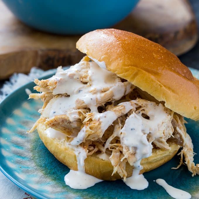 <p><strong>Pulled Chicken with White Sauce Sandwich</strong></p><p>In the heart of barbecue country, Alabama is home to its whole smoked chickens and rare mayo-based white barbecue sauce. The chickens are smoked over hickory wood for three hours before being doused in tangy sauce, served on a toasted bun and topped with slaw. Try the original at <a href="https://bigbobgibson.com/" rel="nofollow noopener" target="_blank" data-ylk="slk:Big Bob Gibson’s Bar-B-Q;elm:context_link;itc:0;sec:content-canvas" class="link ">Big Bob Gibson’s Bar-B-Q</a> in Decatur.</p>