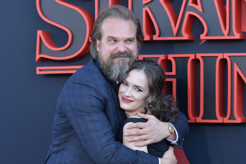 David Harbour hugging Winona Ryder