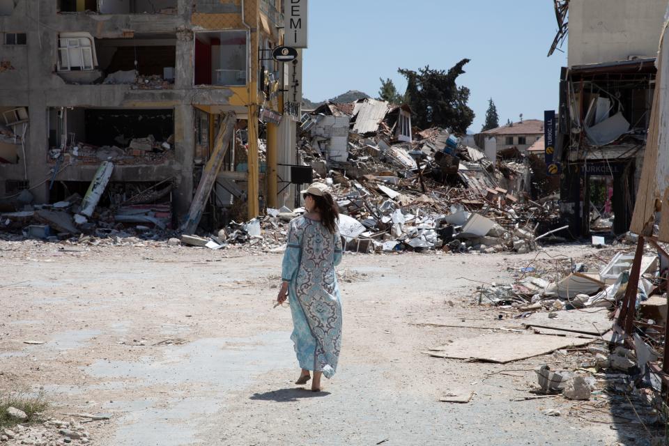 UNFPA Global Goodwill Ambassador Ashley Judd walks through streets in Antakya, Hatay, where the damage and destruction from the earthquakes in February 2023 is still visible.