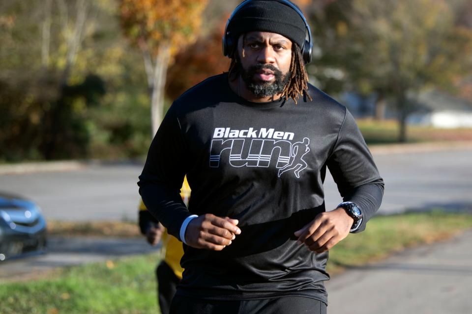 Denzel Grant, co-captain of the Knoxville chapter of Black Men Run, jogs at Victor Ashe Park on Nov. 13.