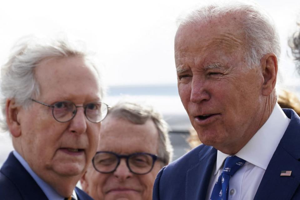 <div class="inline-image__caption"><p>Joe Biden is greeted by Mitch McConnell (R-KY) and Ohio Governor Mike DeWine as he arrives at Cincinnati Northern Kentucky Airport in Hebron, Kentucky on January 4, 2023.</p></div> <div class="inline-image__credit">REUTERS/Kevin Lamarque</div>