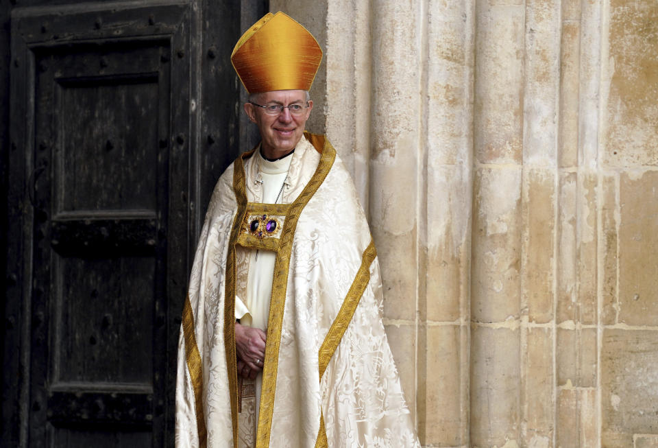 FILE - Archbishop of Canterbury Justin Welby stands at Westminster Abbey ahead of the coronation of King Charles III and Camilla, the Queen Consort, in London, Saturday, May 6, 2023. Singer Shirley Bassey, director Ridley Scott and England goalkeeper Mary Earps were recognized Friday, Dec. 29, 2023 in the U.K.’s New Year Honors list, which celebrates the achievements and services of more than 1,000 people across the country. Other well-known names on the list include “The Great British Bake Off” judge Paul Hollywood, “Game of Thrones” actor Emilia Clarke, and Justin Welby, the Archbishop of Canterbury. (Andrew Milligan/Pool via AP, File)