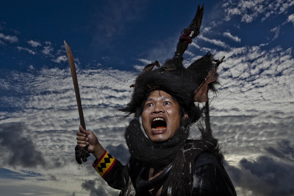 NIAS ISLAND, INDONESIA - FEBRUARY 22: A villager wearing traditional war dress known as leama poses in Bawomataluo village on February 22, 2013 in Nias Island, Indonesia. Stone Jumping is a traditional ritual, with locals leaping over large stone towers, which in the past resulted in serious injury and death. Stone jumping in Nias Island was originally a tradition born of the habit of inter tribal fighting on the island of Nias. (Photo by Ulet Ifansasti/Getty Images)