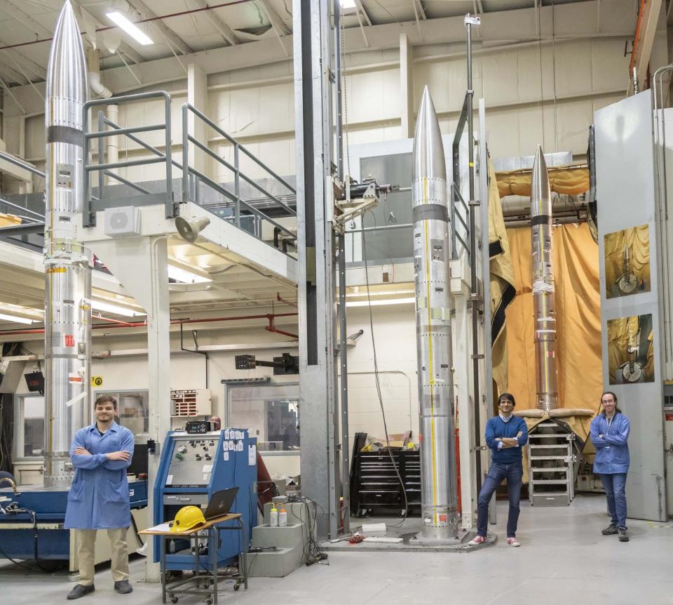 Embry-Riddle Aeronautical University researchers (from left) Nathan Graves, Aroh Barjatya and Robert Clayton stand next to the three payloads and nose cones that will be attached to NASA rockets launching into the ionosphere on April 8 during a solar eclipse.