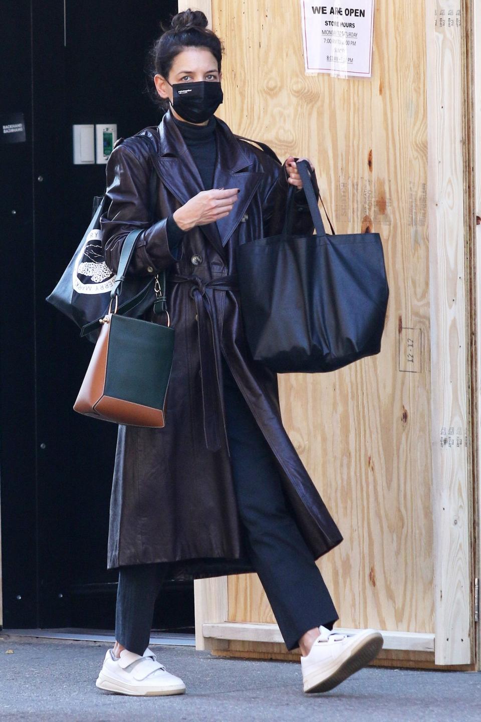 <p>Katie Holmes carries a handful of bags while running errands on Wednesday in N.Y.C.</p>