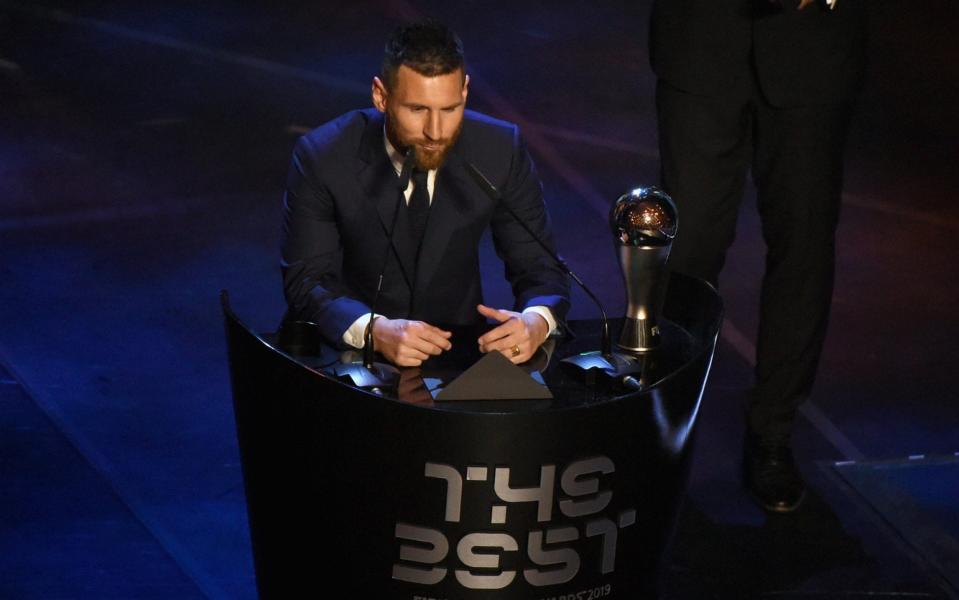 Leo Messi picks up his award, but Telegraph Sport understands Ronaldo was due to attend - Anadolu