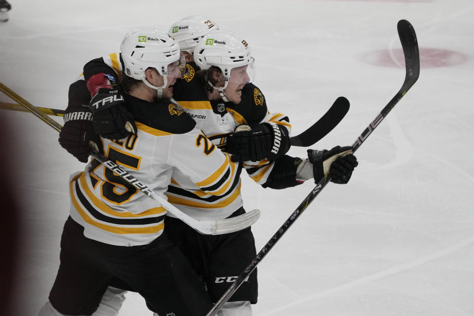 Boston Bruins left wing Tyler Bertuzzi (59), center, celebrates a goal during the third period of Game 4 of an NHL hockey Stanley Cup first-round playoff series against the Florida Panthers, Sunday, April 23, 2023, in Sunrise, Fla. (AP Photo/Marta Lavandier)