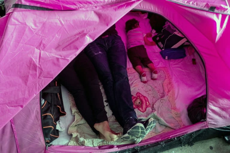 The Mendez family, shown resting in their tent at a migrant shelter in Tijuana, Mexico, say returning to their native El Salvador is not an option and they are seeking asylum in the US