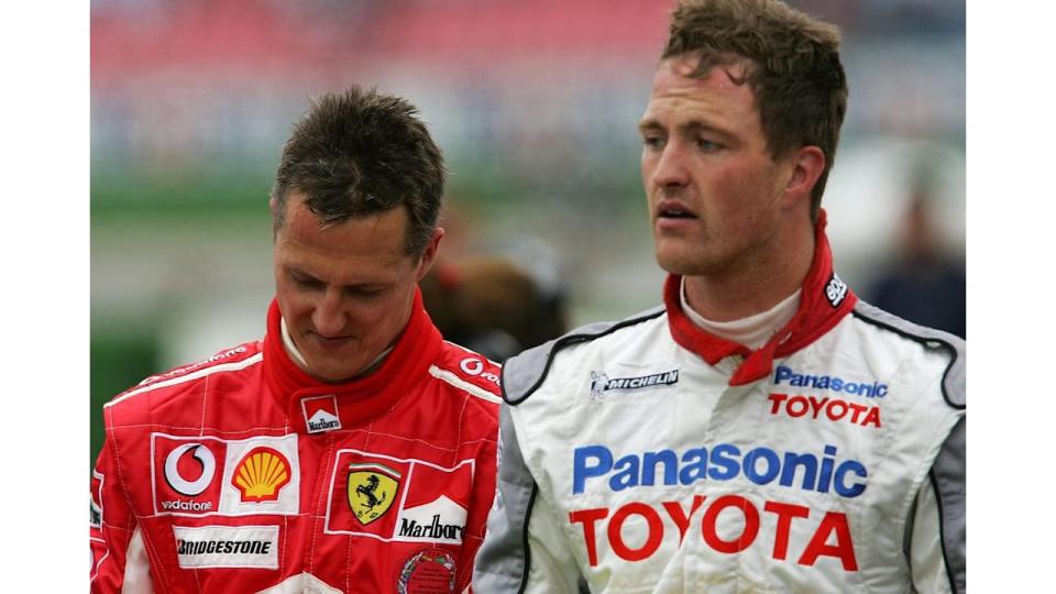 Michael Schumacher walking with Ralf Schumacher