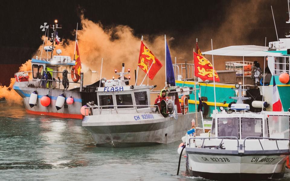 French fishermen angry over loss of access to waters gathered their boats in protest off the English Channel island of Jersey in May. - Oliver Pinel 