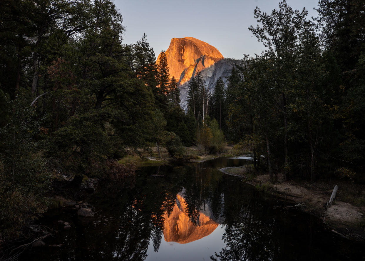 Half Dome view with reflection during sunset in Yosemite National Park, Calif.