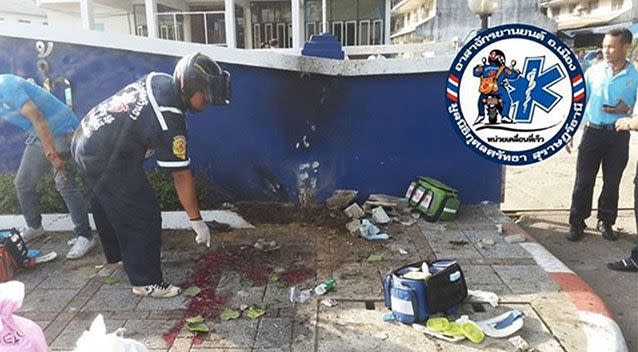 Blood is spilled outside the Surat Thani Police station. Picture: Twitter/FM91