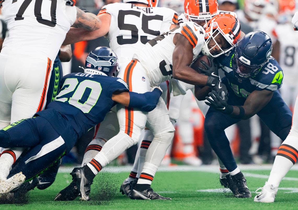 Seattle Seahawks linebacker Tyrice Knight (48) tackles Cleveland Browns running back Jerome Ford (34) during the first quarter of the preseason game at Lumen Field, on Saturday, Aug. 24, 2024 in Seattle, Wash.