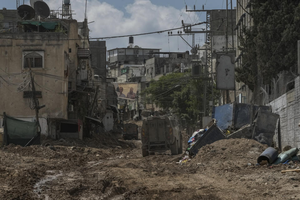 A convoy of Israeli military armored vehicles is seen during an army raid in Tulkarem, West Bank, on Tuesday, Sept. 3, 2024. (AP Photo/Majdi Mohammed)