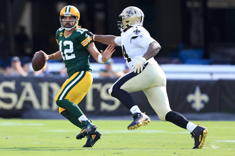 Aaron Rodgers #12 of the Green Bay Packers looks to pass against Cameron Jordan #94 of the New Orleans Saints during the first half at TIAA Bank Field on September 12, 2021 in Jacksonville, Florida.