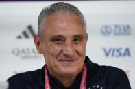 Brazil's head coach Tite smiles during a press conference on the eve of World Cup round of 16 soccer match between Brazil and South Korea in Doha, Qatar, Sunday, Dec. 4, 2022. (AP Photo/Andre Penner)