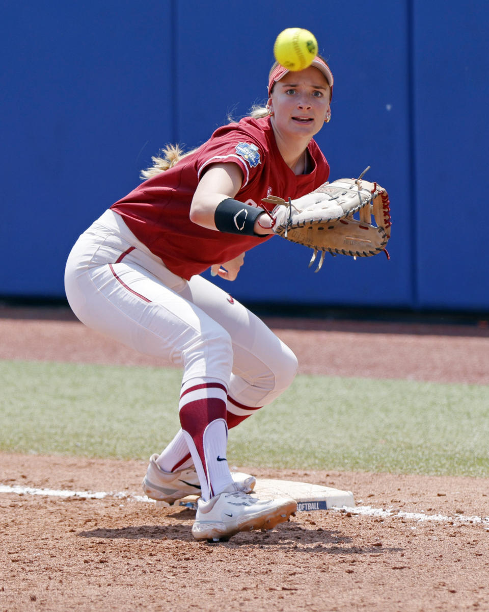 Stanford's Emily Schultz watches the ball before making a catch for an out at first base against Oklahoma during the fourth inning of an NCAA softball Women's College World Series game Monday, June 5, 2023, in Oklahoma City. (AP Photo/Nate Billings)