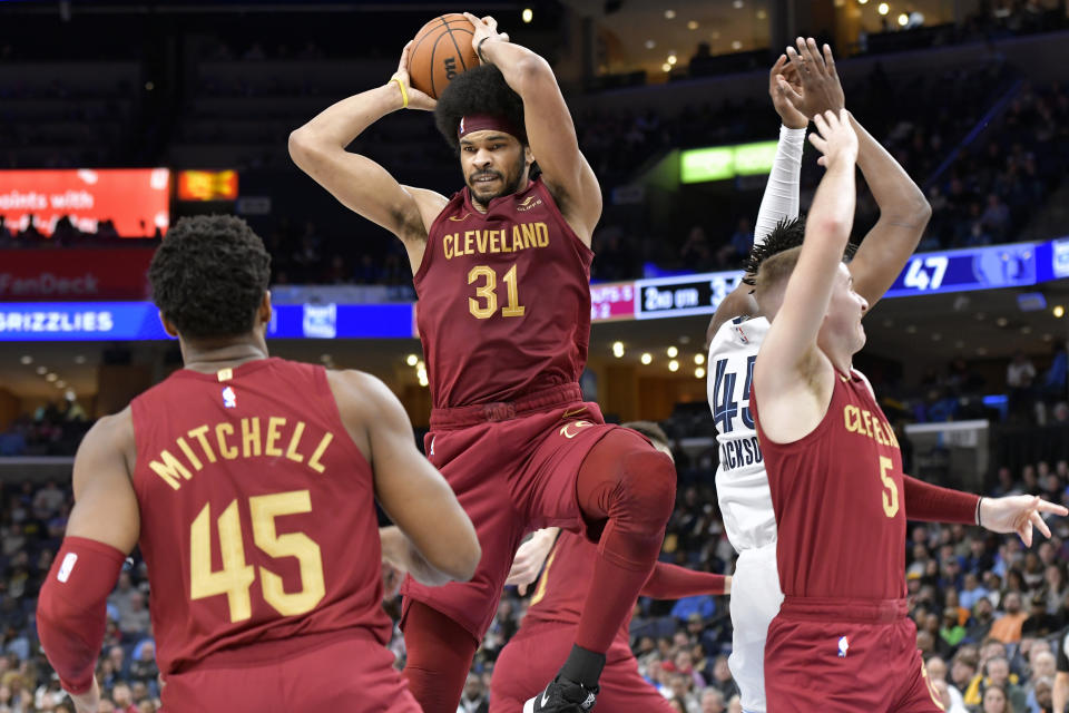 Cleveland Cavaliers center Jarrett Allen (31) handles the ball in the second half of an NBA basketball game against the Memphis Grizzlies Thursday, Feb. 1, 2024, in Memphis, Tenn. (AP Photo/Brandon Dill)