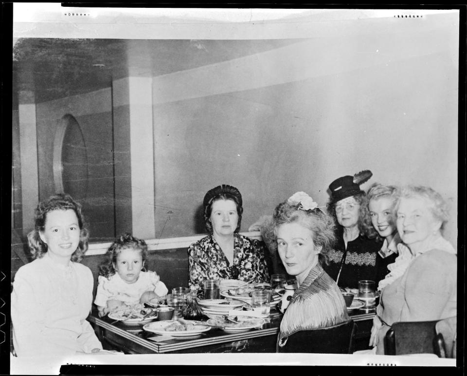 <p>Norma did see extended family members at times. Here, they're at a restaurant with Norma on the far right, center. </p>