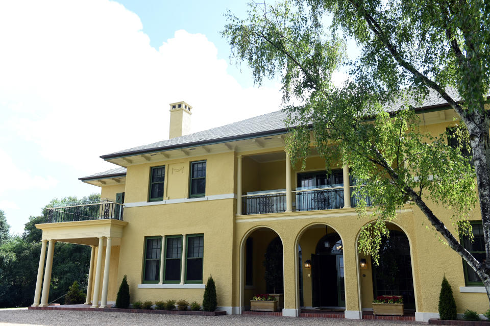 The exterior of The Lodge in Canberra on Monday, Jan. 25, 2016. The historic home has been vacant since 2013 and has undergone extensive renovations to replace the slate roof, rusty plumbing, wiring, and to remove asbestos. (AAP Image/Mick Tsikas)