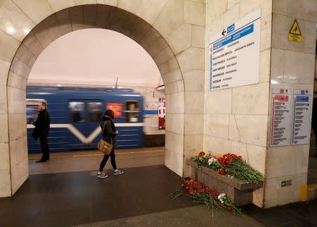 Flowers in memory of victims of a blast in St. Petersburg metro are seen laying at Tekhnologicheskiy institut metro station in St. Petersburg, Russia, April 4, 2017. REUTERS/Grigory Dukor